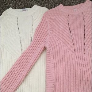 Pink & white twin sweaters.